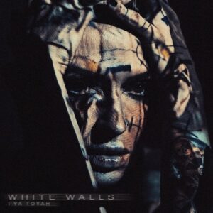 I Ya Toyah – White Walls single cover: high-contrast portrait with projected grid patterns across face and hands, WHITE WALLS and I YA TOYAH in the lower left