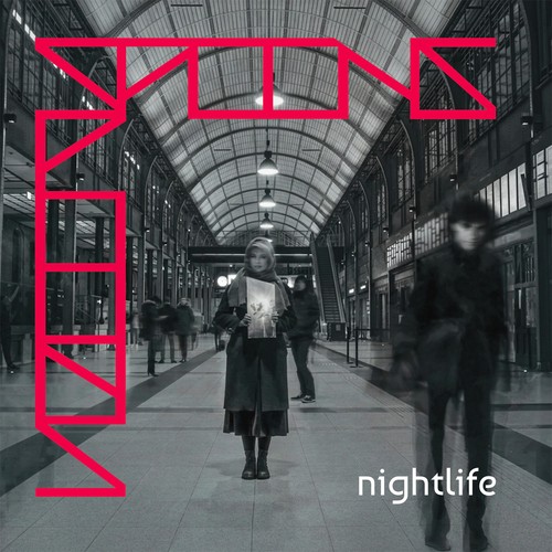 Spoons – Nightlife album cover: black-and-white photo of a glass-roofed station hall with a woman standing in the centre and a blurred figure walking past, red outline lettering spelling SPOONS and the word nightlife in the lower right