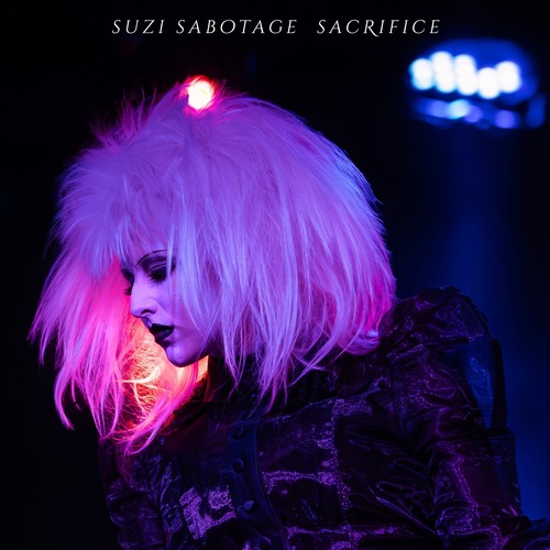 Suzi Sabotage – Sacrifice single cover: portrait photo by Sasha Araya used as the artwork for the October 2026 Out Of Line Music release